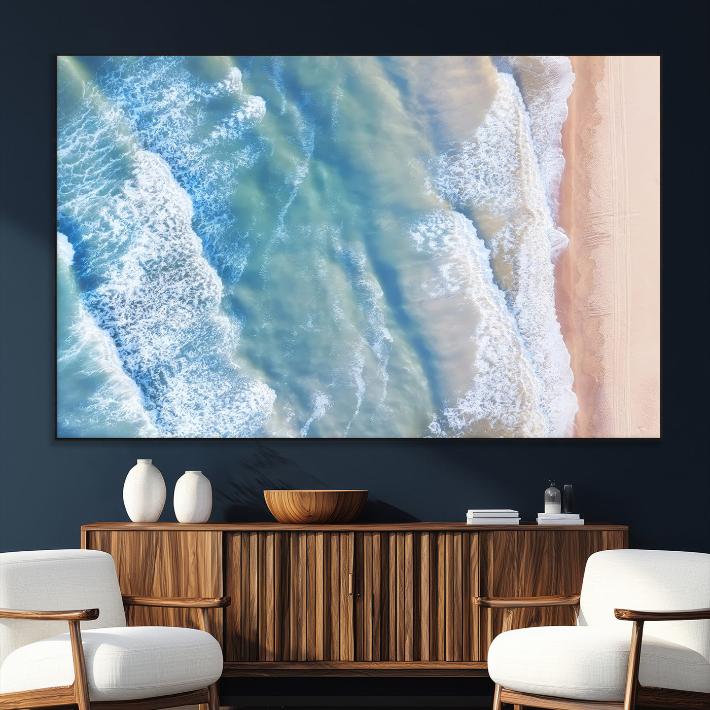 Aerial photo of soft blue waves meeting sandy shore, perfect for modern coastal or beach-themed decor with a light and tranquil aesthetic.