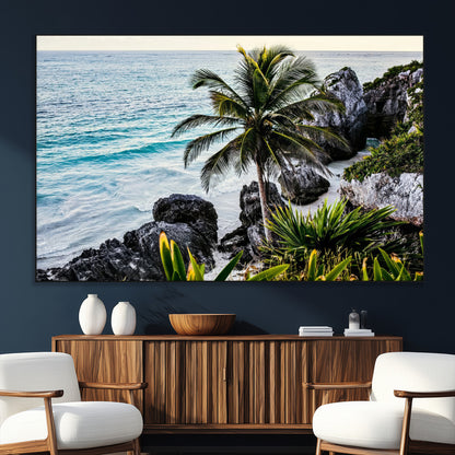 Framed canvas of a vibrant tropical coastline with palm trees, rocky cliffs, and turquoise waters, ideal for tropical coastal home decor.