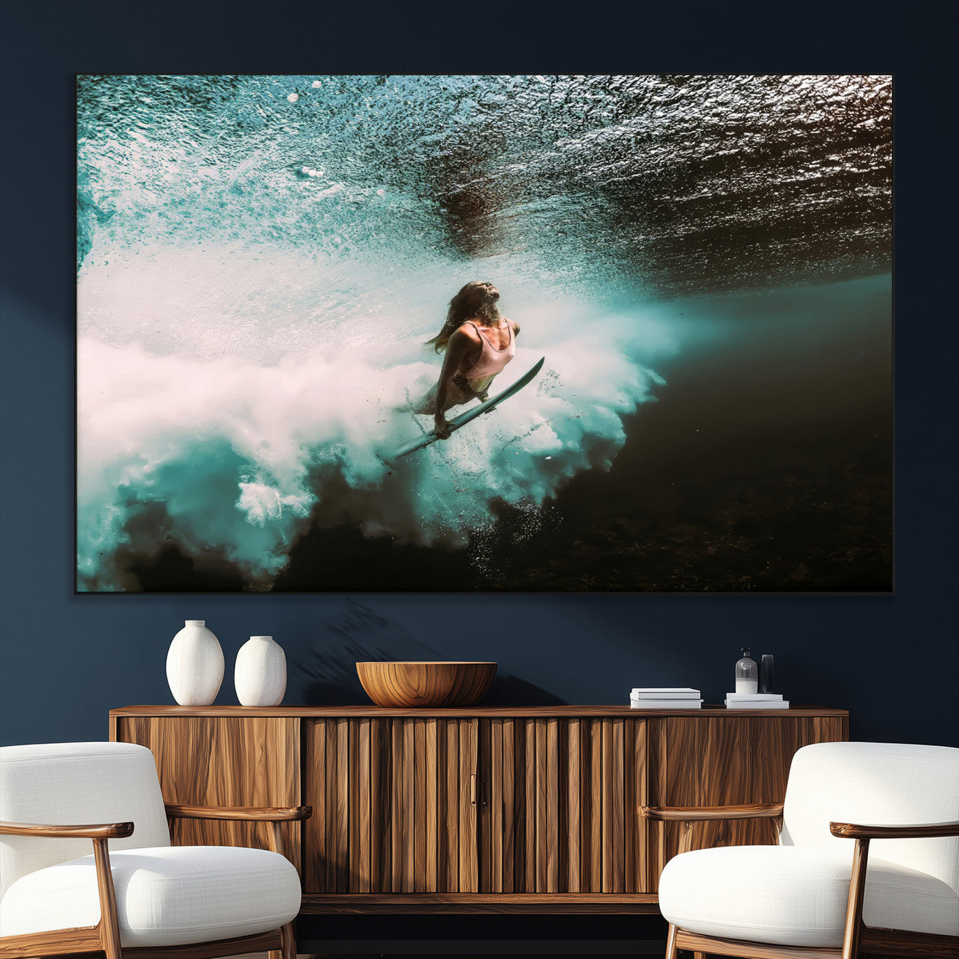 Vibrant underwater photo of a female surfer diving through turquoise waves, perfect for coastal boho or surf-inspired home decor.