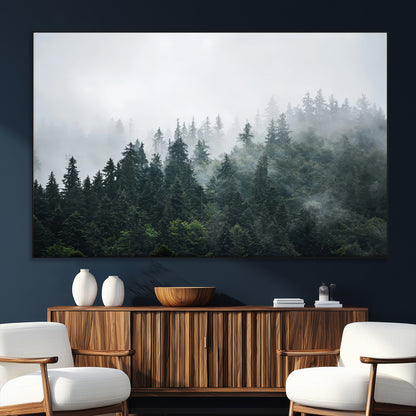 A misty evergreen forest shrouded in soft fog, creating a tranquil and moody landscape with lush green trees fading into the distance.