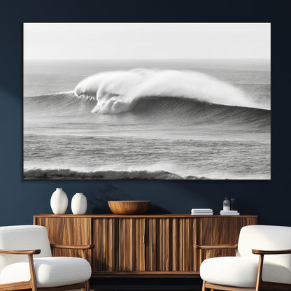 A dramatic black and white ocean wave crashing with immense force, capturing the raw power and movement of the sea in a bold seascape.