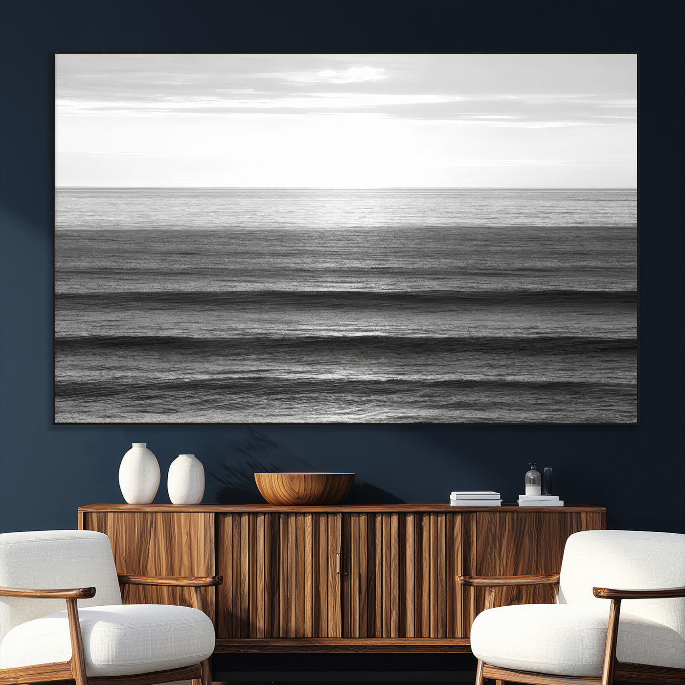 Minimalist black and white ocean view with layered waves reflecting sunlight, evoking a sense of calm and coastal serenity.