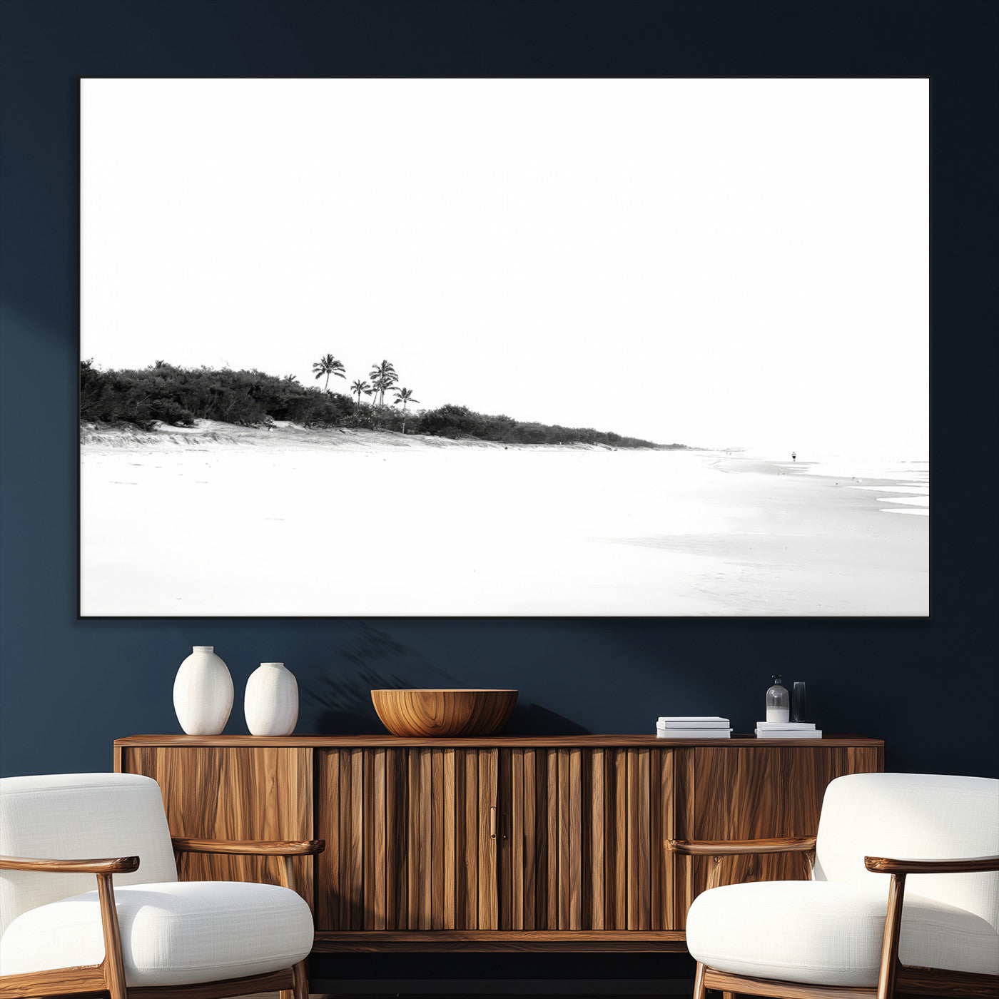 A black and white minimalist coastal scene with a vast open beach, distant palm trees, and a lone figure walking along the shoreline, evoking serenity and solitude.