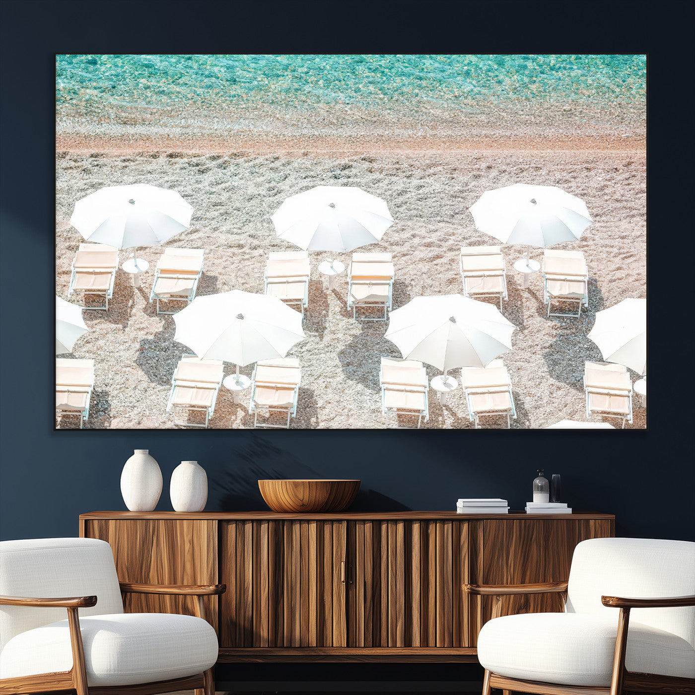 A bright beach scene with white umbrellas, pastel sand, and turquoise waters, creating a tranquil coastal vibe, perfect for beach house or summer decor.