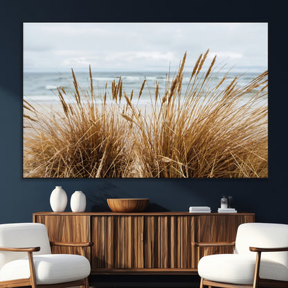 Canvas of golden beach grass swaying by the ocean under a soft cloudy sky, perfect for neutral-toned or coastal minimalist decor.