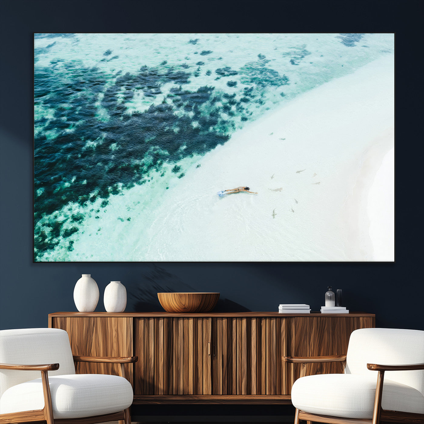 Canvas featuring an aerial view of a swimmer in shallow turquoise waters with coral patterns, ideal for tropical coastal home decor.