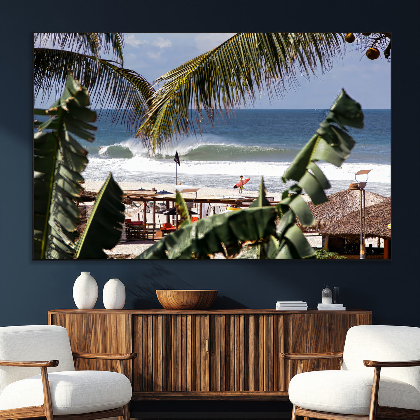 Canvas wall art of a tropical surf scene framed by palm trees, with a surfer on the shore and waves rolling in, ideal for beach-themed decor.