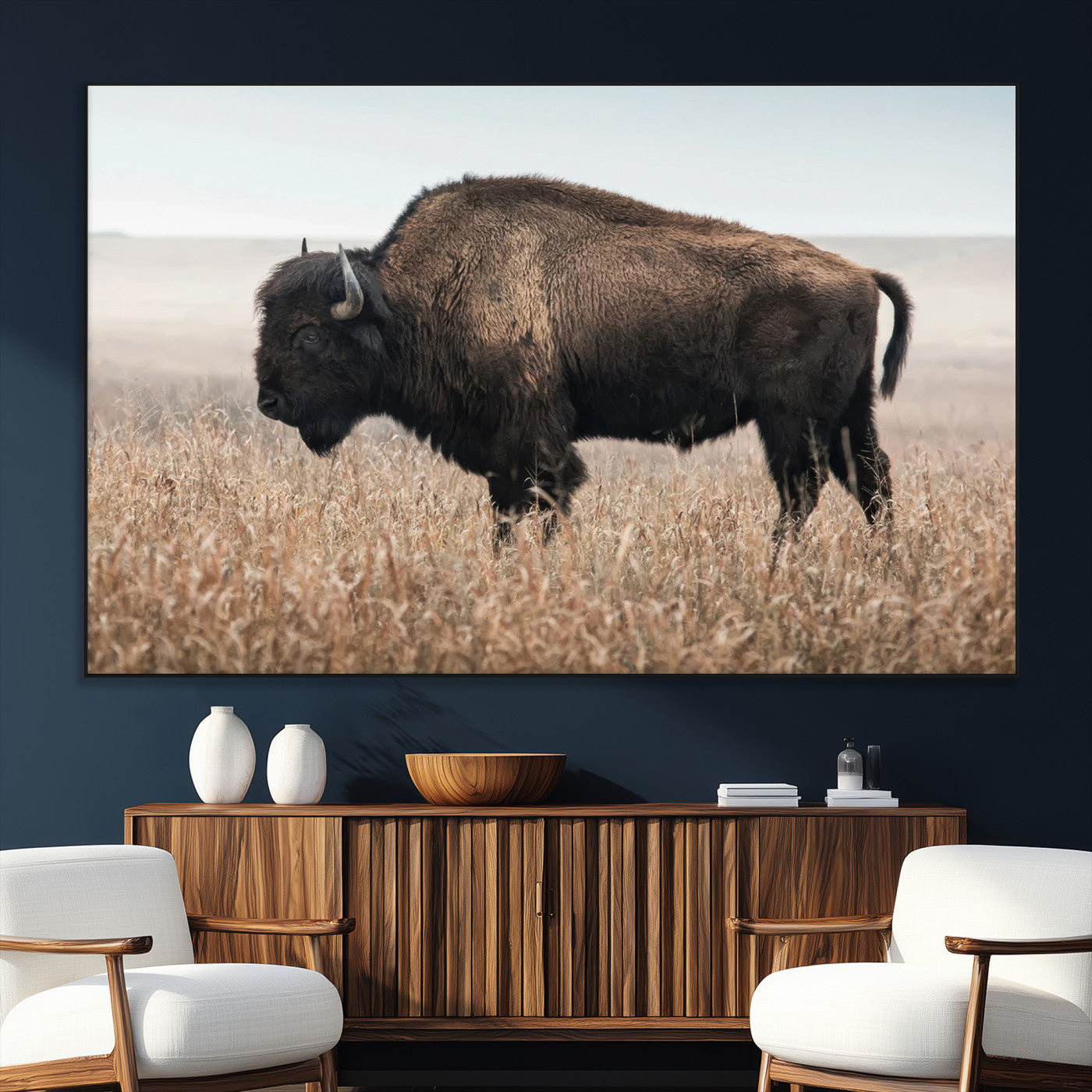 A lone bison stands in a vast prairie under a soft sky, evoking freedom and rustic charm for western or farmhouse inspired interiors.