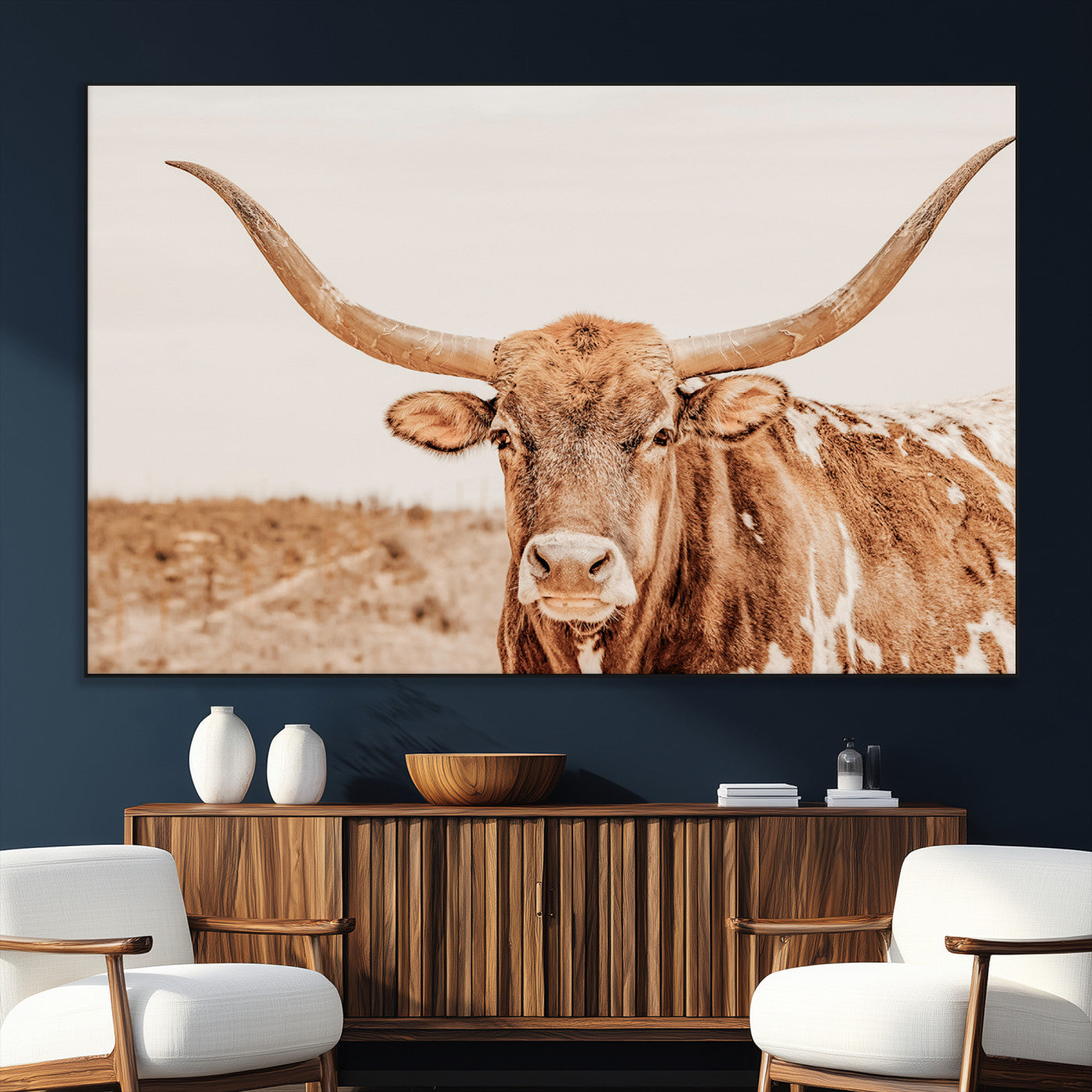 A longhorn bull standing proudly in a sunlit desert field with warm neutral tones, ideal for rustic western or farmhouse interiors.