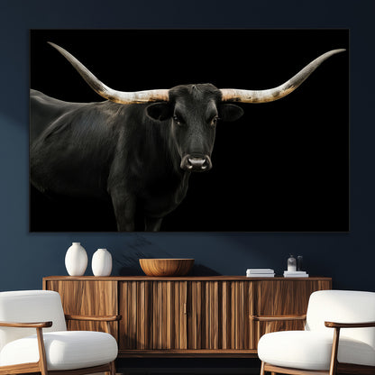 Close-up of a black Texas longhorn with large curved horns on black background, ideal for rustic farmhouse or modern western interiors.