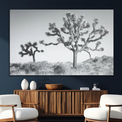 Black and white Joshua tree in a desert landscape with soft light and dry brush, perfect for rustic or minimalist home decor.