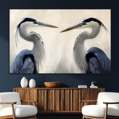 Two blue herons facing each other on a soft neutral background, ideal for coastal, tranquil, or nature-inspired minimalist interiors.