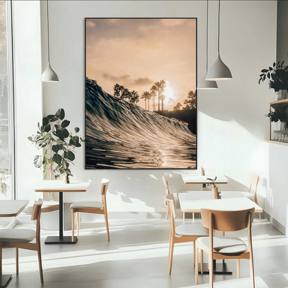 Golden sunset view of an ocean wave curling near palm trees, radiating warm tones perfect for coastal or tropical-themed decor.