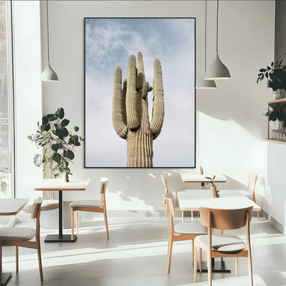 Vertical photo of a tall saguaro cactus against a soft sky, ideal for earthy or Southwestern home decor with warm neutral tones.