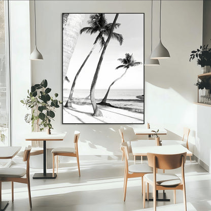 Black and white wall art of palm trees and a hammock on a beach, ideal for coastal minimalist or tropical-themed decor.