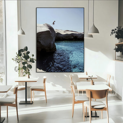 Canvas of a cliff diver above turquoise waters and rocky coastline under clear sky, ideal for adventurous minimalist or coastal home decor.