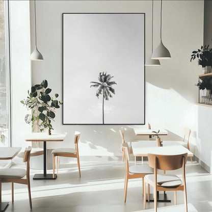 Canvas of a single palm tree in black and white with minimalist sky, ideal for modern coastal minimalist or tropical-inspired home decor.