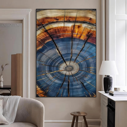 Canvas of a tree ring with bold blue and orange hues and cracked radial lines, ideal for rustic or earthy modern interiors.