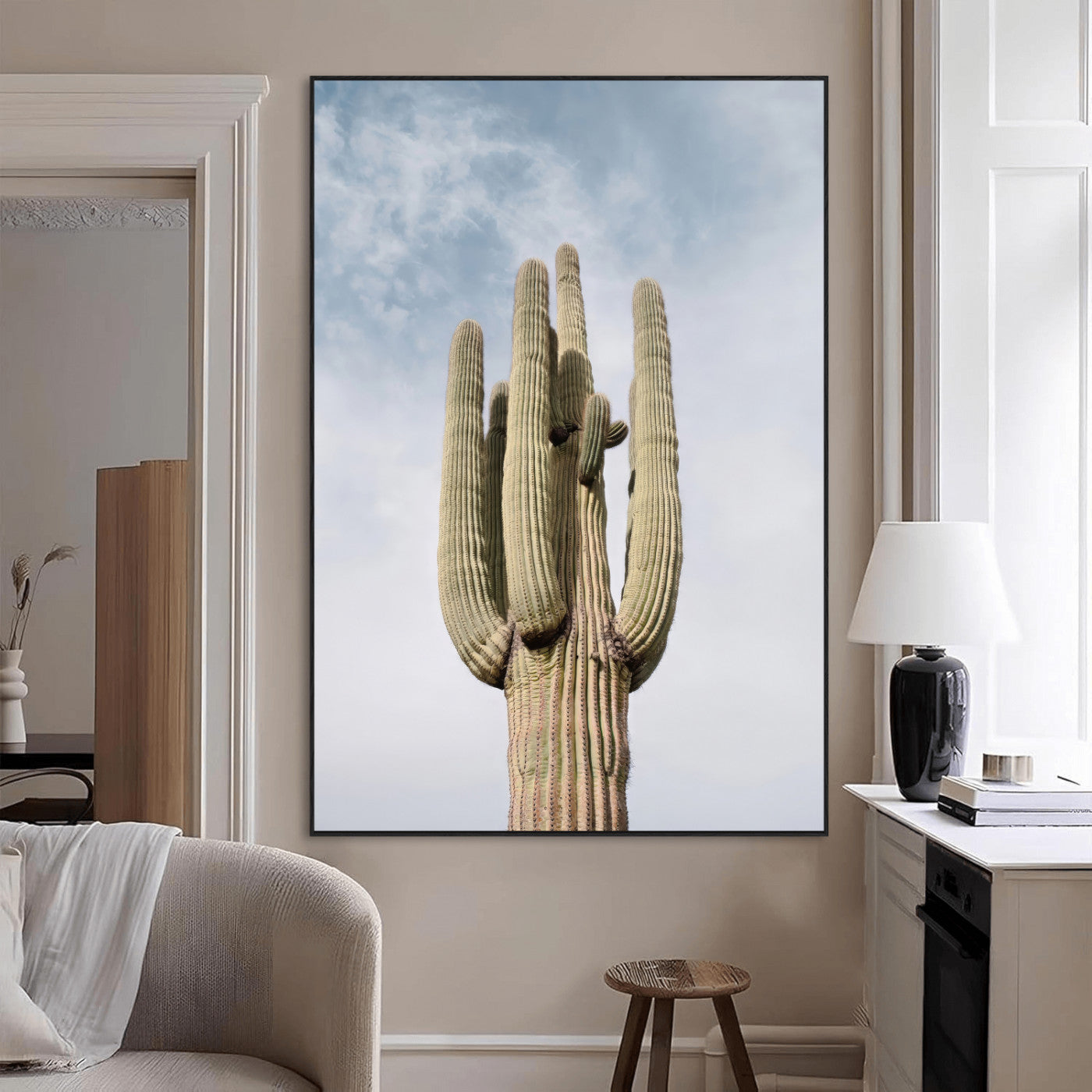 Vertical photo of a tall saguaro cactus against a soft sky, ideal for earthy or Southwestern home decor with warm neutral tones.