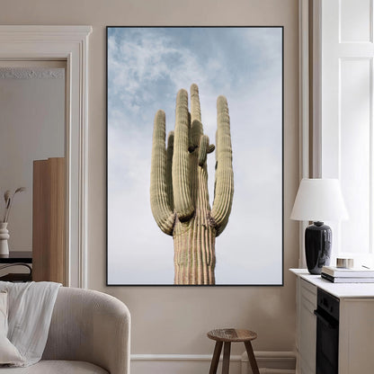 Vertical photo of a tall saguaro cactus against a soft sky, ideal for earthy or Southwestern home decor with warm neutral tones.