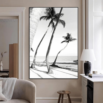 Black and white wall art of palm trees and a hammock on a beach, ideal for coastal minimalist or tropical-themed decor.