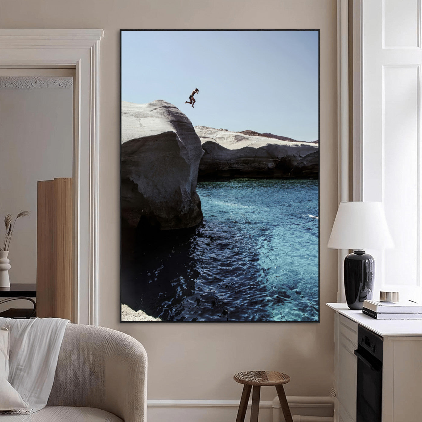 Canvas of a cliff diver above turquoise waters and rocky coastline under clear sky, ideal for adventurous minimalist or coastal home decor.