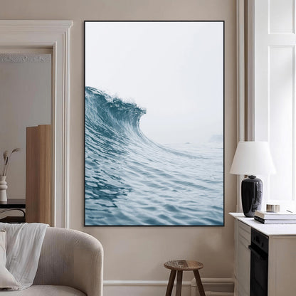 A single ocean wave curling in soft blue tones under a misty sky, ideal for coastal or minimalist home wall decor.