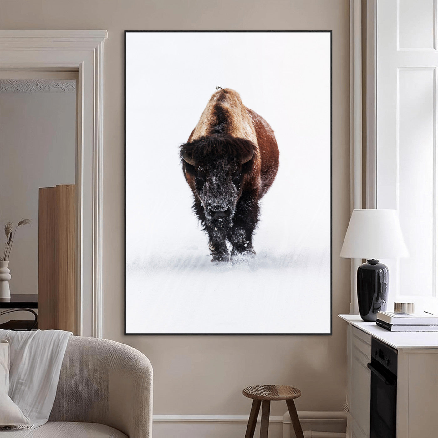 Front view of a strong bison walking in deep snow, isolated white background, perfect for rustic or lodge-style home decor.