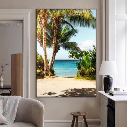 Tropical beach with palm trees, blue ocean, and clear sky, perfect for coastal or beach-themed wall decor in sunny living spaces.