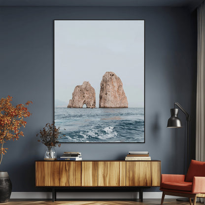 Serene photograph of the Faraglioni rocks in Capri with calm blue waters, perfect for Mediterranean coastal or minimalist travel-themed decor.