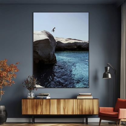 Canvas of a cliff diver above turquoise waters and rocky coastline under clear sky, ideal for adventurous minimalist or coastal home decor.