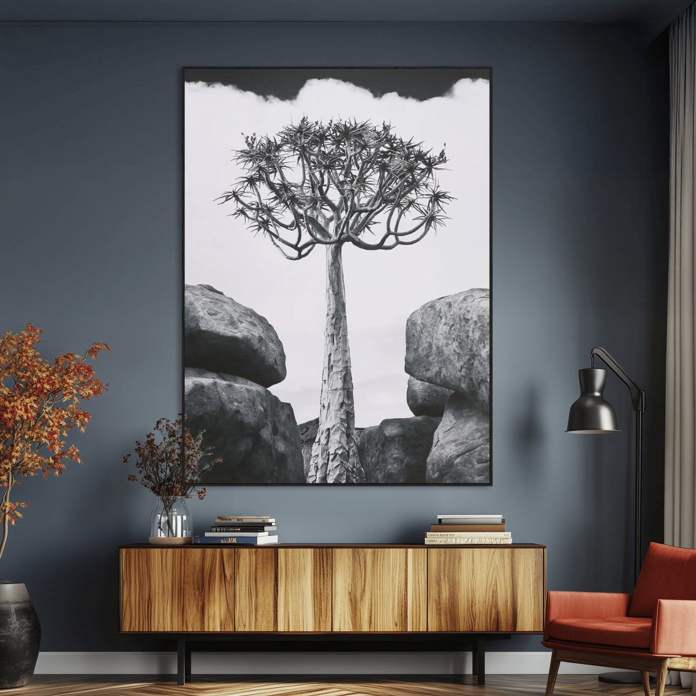 Tall desert tree in black and white, standing between large rocks, perfect for bold and minimalist nature-themed interior spaces.