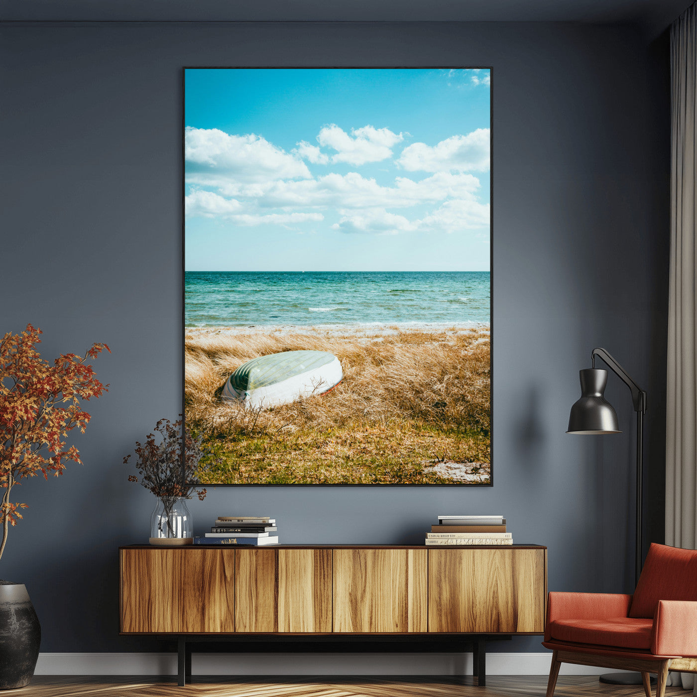 A small boat resting on a grassy shore with ocean waves and a bright blue sky, creating a peaceful coastal atmosphere.