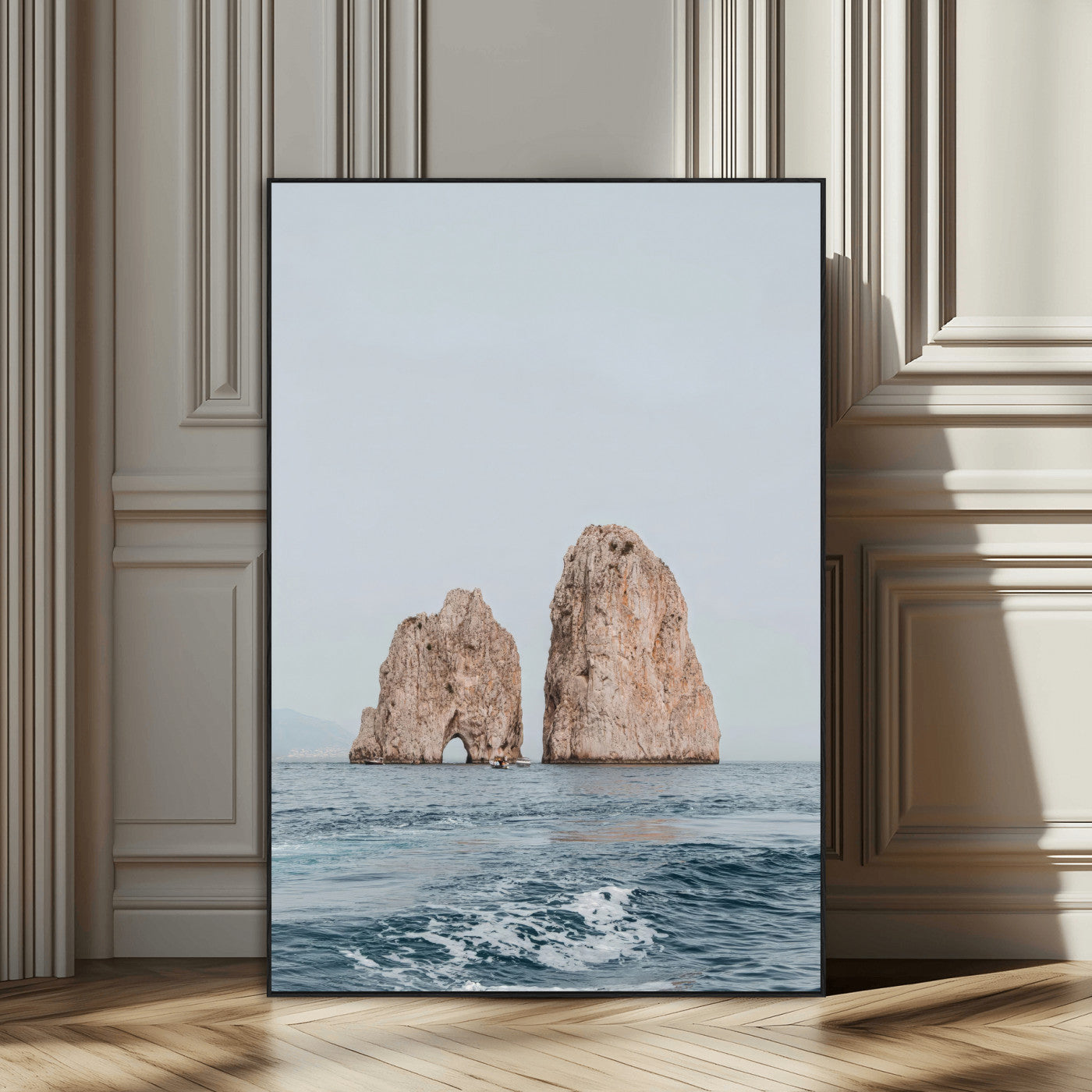 Serene photograph of the Faraglioni rocks in Capri with calm blue waters, perfect for Mediterranean coastal or minimalist travel-themed decor.