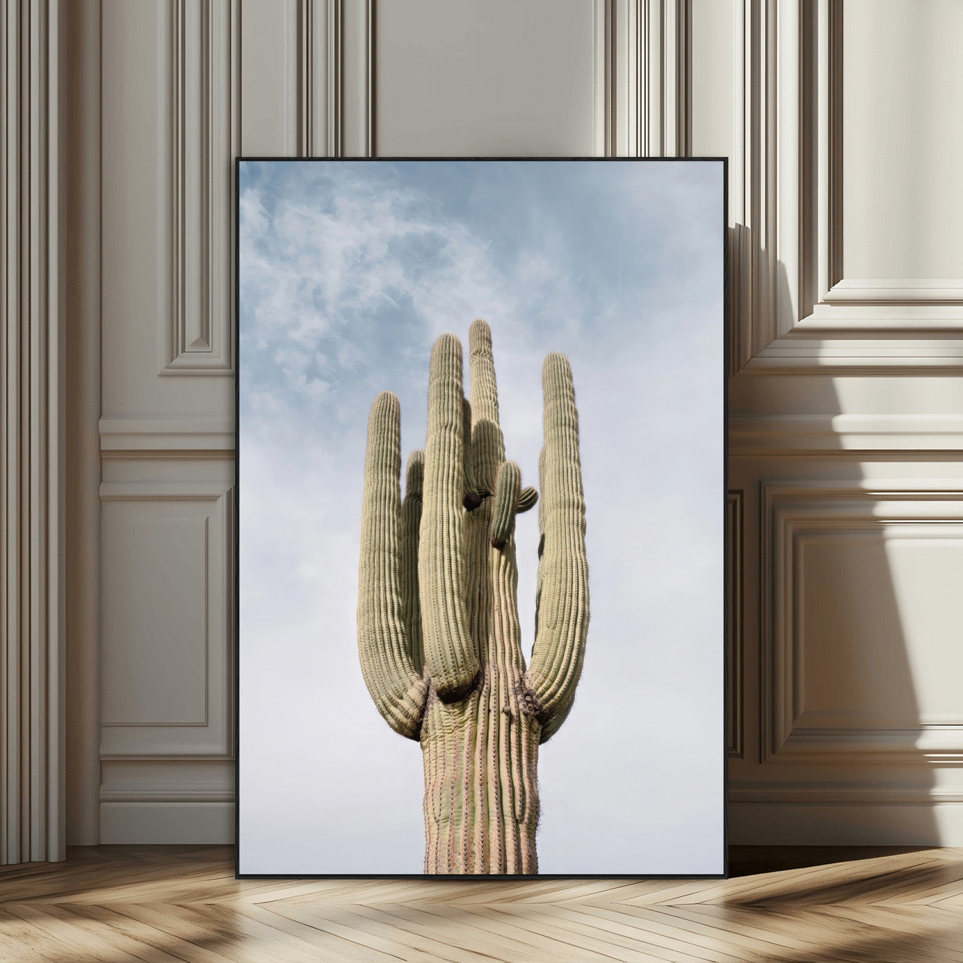 Vertical photo of a tall saguaro cactus against a soft sky, ideal for earthy or Southwestern home decor with warm neutral tones.