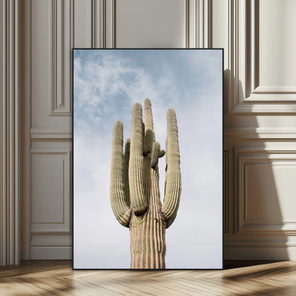 Vertical photo of a tall saguaro cactus against a soft sky, ideal for earthy or Southwestern home decor with warm neutral tones.