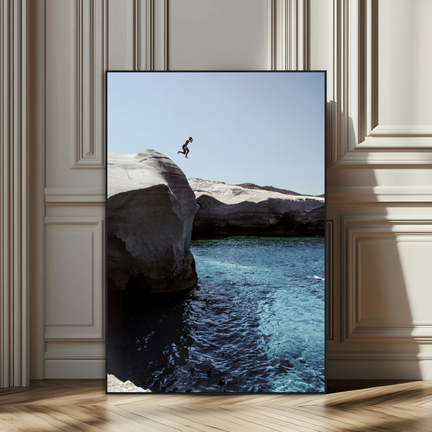 Canvas of a cliff diver above turquoise waters and rocky coastline under clear sky, ideal for adventurous minimalist or coastal home decor.