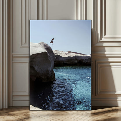 Canvas of a cliff diver above turquoise waters and rocky coastline under clear sky, ideal for adventurous minimalist or coastal home decor.