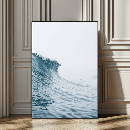 A single ocean wave curling in soft blue tones under a misty sky, ideal for coastal or minimalist home wall decor.