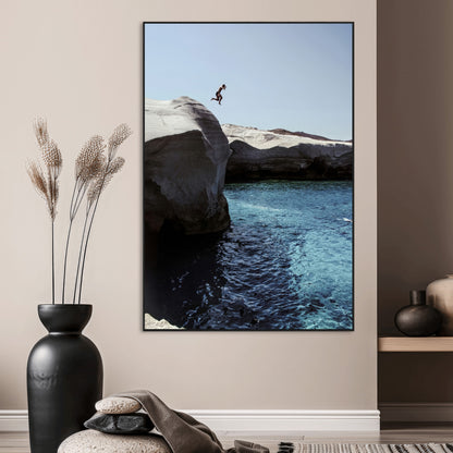 Canvas of a cliff diver above turquoise waters and rocky coastline under clear sky, ideal for adventurous minimalist or coastal home decor.