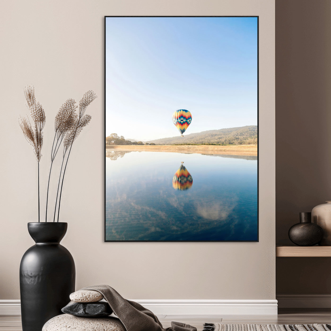 Canvas of a hot air balloon floating above a calm lake with soft reflections and vibrant sky, ideal for modern minimalist or adventure-themed home decor.