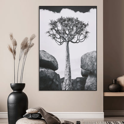 Tall desert tree in black and white, standing between large rocks, perfect for bold and minimalist nature-themed interior spaces.
