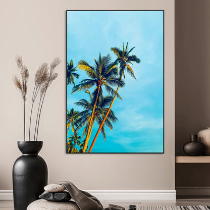 "Tall palm trees with golden sunlight against a vibrant blue sky, creating a tropical, relaxing atmosphere for coastal and beach-themed decor.