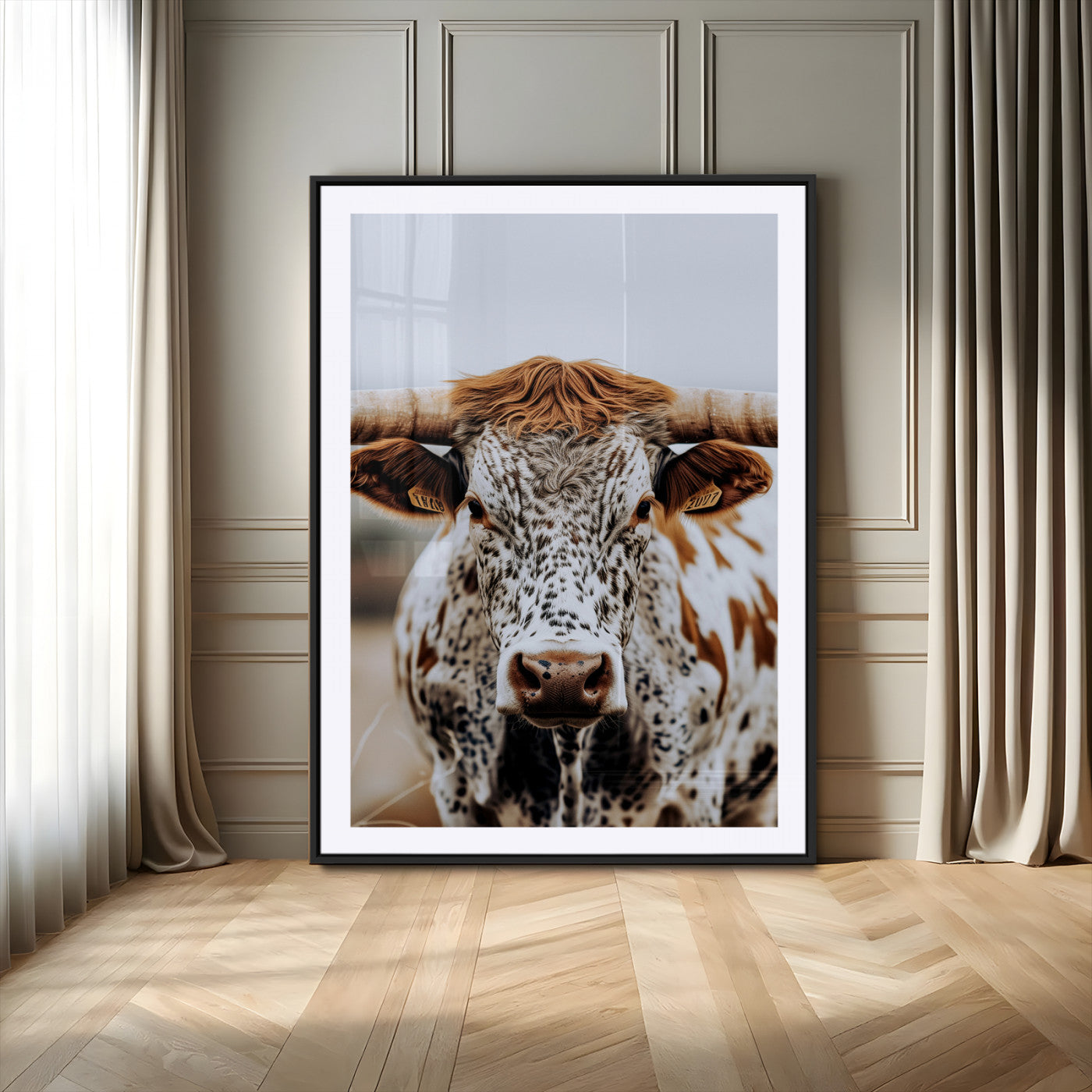 Close-up of a speckled Texas longhorn with wide horns and a bold gaze, perfect for rustic or country-style decor in warm tones.