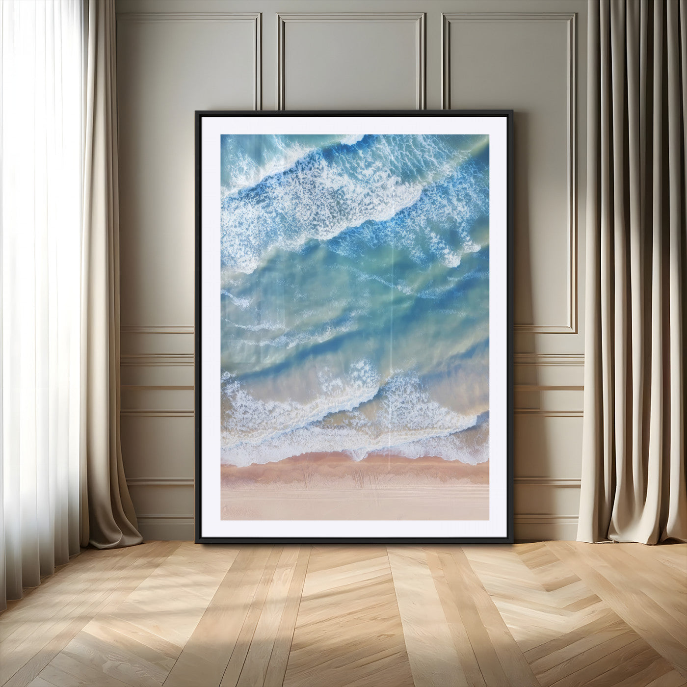 Aerial photo of soft blue waves meeting sandy shore, perfect for modern coastal or beach-themed decor with a light and tranquil aesthetic.