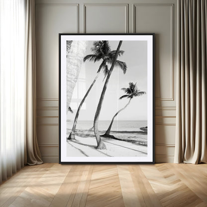 Black and white wall art of palm trees and a hammock on a beach, ideal for coastal minimalist or tropical-themed decor.