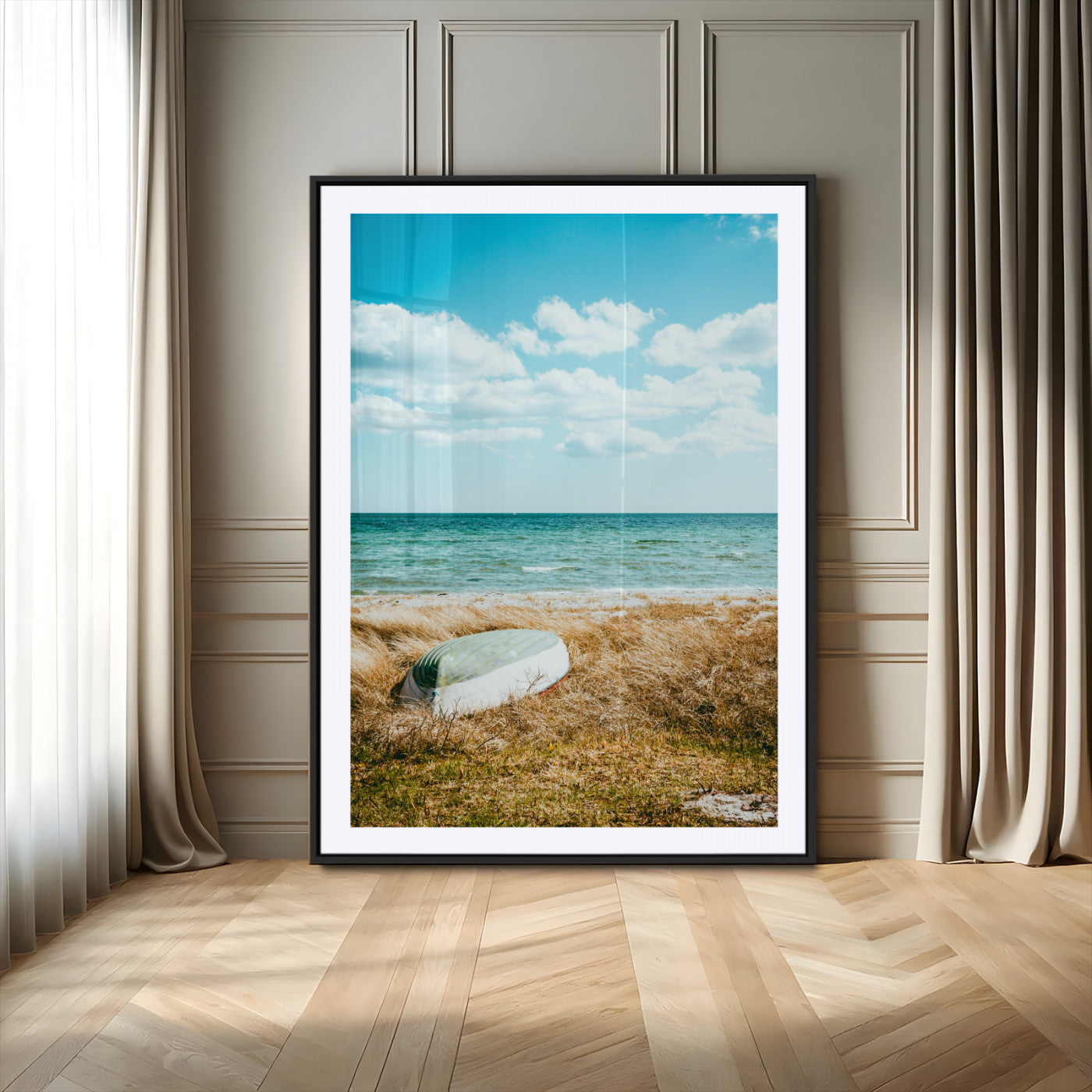 A small boat resting on a grassy shore with ocean waves and a bright blue sky, creating a peaceful coastal atmosphere.