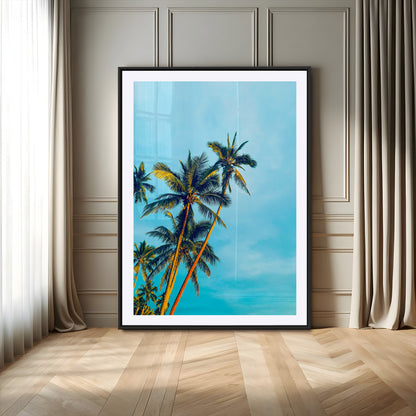 "Tall palm trees with golden sunlight against a vibrant blue sky, creating a tropical, relaxing atmosphere for coastal and beach-themed decor.