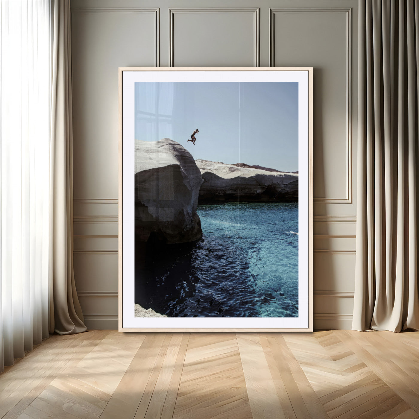 Canvas of a cliff diver above turquoise waters and rocky coastline under clear sky, ideal for adventurous minimalist or coastal home decor.