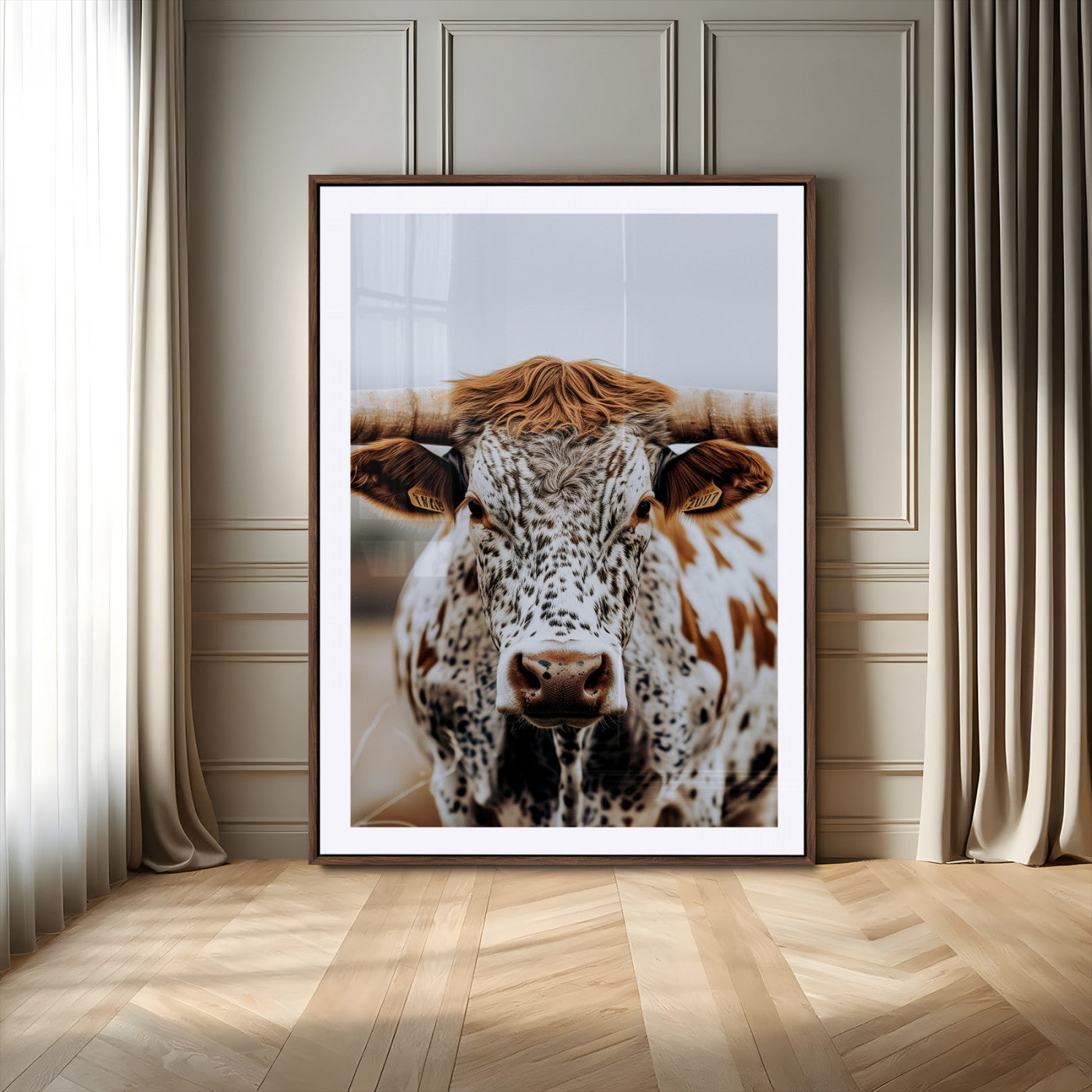 Close-up of a speckled Texas longhorn with wide horns and a bold gaze, perfect for rustic or country-style decor in warm tones.